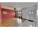 Bright living room with hardwood floors, updated windows, and fresh white paint at 2903 Florida Blvd, Bradenton, FL 34207