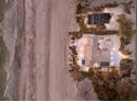 Aerial shot of a beachfront home, revealing a private oasis next to the ocean at 3351 Gulf Of Mexico Dr, Longboat Key, FL 34228