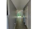 Inviting hallway with new wood flooring leading to the main living area at 4321 Winding River Way, Land O Lakes, FL 34639