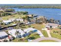 Wide aerial shot captures the home's proximity to the river, boat docks, and the surrounding neighborhood at 541 Ridgecrest Dr, Punta Gorda, FL 33982