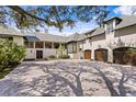 Exterior elevation showcasing the home's architectural features and manicured landscaping at 72 Adalia Ave, Tampa, FL 33606