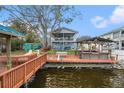 This home's backyard has a waterside patio, perfect for outdoor living and entertaining at 9920 Alavista Dr, Gibsonton, FL 33534