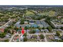 Aerial view of neighborhood featuring golf course, pools and tennis courts at 10064 82Nd St, Seminole, FL 33777