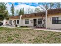Well-kept townhomes featuring manicured lawns and cozy front patios with seating at 1273 Mission Cir, Clearwater, FL 33759