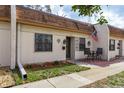 Inviting townhome showcasing a charming front patio, neat landscaping, and a welcoming entrance at 1273 Mission Cir, Clearwater, FL 33759