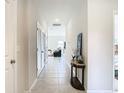 Hallway leading into living room with tile flooring at 35524 Quartz Lake Dr, Zephyrhills, FL 33541