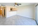 This living room features a breakfast bar, recessed lighting, tile floors, and a ceiling fan at 5820 N Church Ave # 430, Tampa, FL 33614