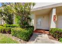 Charming front entrance with lush landscaping and a well-maintained exterior featuring brick steps at 6290 Bahia Del Mar Cir # 5, St Petersburg, FL 33715