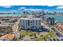 Exterior showcasing the surrounding community, landscaping, and a view of the waterfront at 855 Bayway Blvd # 105, Clearwater, FL 33767