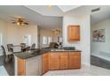 Open kitchen featuring granite countertops, stainless steel appliances, and views into the living area at 14 Somerset St # 5C, Clearwater, FL 33767