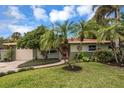 Beautiful single-story home with a well-manicured lawn and attached garage at 2221 59Th S St, Gulfport, FL 33707