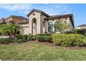 Inviting single-Gathering home featuring a well-maintained lawn and stylish front entrance at 4016 Cadence Loop, Land O Lakes, FL 34638