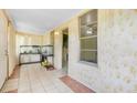 Light-filled sunroom with tile flooring, offering a cozy and bright space at 4804 N 10Th St, Tampa, FL 33603