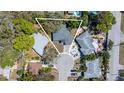 Aerial view of home showing the roof, backyard and surrounding neighborhood at 138 Edgewater Ter, Dunedin, FL 34698