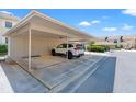 Assigned carport featuring secure storage and convenient resident parking at 2462 Kingfisher Ln # J203, Clearwater, FL 33762