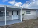 A wider angle of the front porch and door of a home at 3641 Dickens Dr, Holiday, FL 34691
