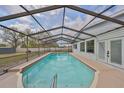 Inviting screened-in pool with crystal-clear water, perfect for relaxation and entertaining at 6333 Spanish Main Dr, Apollo Beach, FL 33572