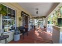 Inviting front porch with decorative plants, stylish furniture, and a relaxing atmosphere to enjoy the outdoors at 912 E 23Rd Ave, Tampa, FL 33605