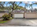 Charming townhome featuring a private garage and well-maintained landscaping in a desirable community at 10607 Carrollbrook Way # 10607, Tampa, FL 33618
