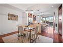 Bright dining area featuring modern light fixture and hardwood floors at 111 N 12Th St # 1314, Tampa, FL 33602