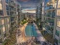Beautiful outdoor pool area, surrounded by lush landscaping and modern condominium buildings at 111 N 12Th St # 1314, Tampa, FL 33602