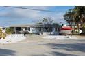 Charming one-story house with white rock landscaping, providing curb appeal at 1310 Boca Ciega Isle Dr, St Pete Beach, FL 33706