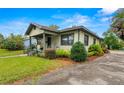 Well-maintained home exterior with manicured landscaping and a cozy front porch at 37713 Florida Ave, Dade City, FL 33525