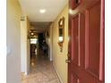 Inviting entryway with tile flooring and neutral paint, leading to the main living area at 11204 Pembridge Ct # 5, Port Richey, FL 34668