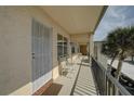 Inviting balcony with seating offers an outdoor space to relax and enjoy views of the surrounding area at 11620 Park Blvd # 308, Seminole, FL 33772