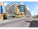 Attractive exterior of the apartment building with palm trees and street view at 1208 E Kennedy Blvd # 1019, Tampa, FL 33602