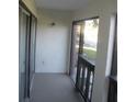 View of the outdoor area from this condo's enclosed balcony at 200 N Bayshore Blvd # 105, Clearwater, FL 33759