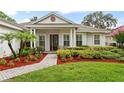 Close up view of a beautiful house with well-maintained landscaping and a brick walkway at 2209 Branch Hill St, Tampa, FL 33612