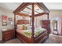 Beautiful main bedroom featuring a four-poster bed and coordinated furnishings at 2824 Conch Hollow Dr, Brandon, FL 33511