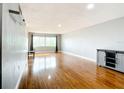 Bright living room with wood floors, grey walls, and a large window with great natural light at 4570 Overlook Ne Dr # 282, St Petersburg, FL 33703