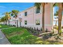 Charming two-story condo with lush landscaping and a sidewalk at 4842 Coquina Key Se Dr # B, St Petersburg, FL 33705