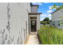 Inviting front entrance with a decorative wreath and a covered porch at 5994 Shiner St, Land O Lakes, FL 34638