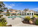 Expansive backyard with pool, spa, covered patio, and lush landscaping creates a private outdoor oasis at 611 Brightwaters Ne Blvd, St Petersburg, FL 33704