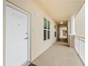 Bright hallway with neutral tones, leading to residences within a well-maintained condominium at 125 Island Way # 402, Clearwater Beach, FL 33767