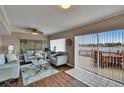 Comfortable living room with water view from large sliding glass doors at 1518 New Bedford Dr, Sun City Center, FL 33573