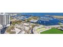 Aerial view showcases the marina near the stadium and coastal skyline at 301 1St S St # 3103, St Petersburg, FL 33701