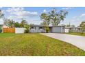 Charming single-story home featuring a well-maintained front yard and painted brick facade at 7030 19Th N Way, St Petersburg, FL 33702