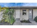 Attractive home exterior featuring dual entrances, fresh landscaping, and modern lighting at 1025 Apollo Beach Blvd # 1, Apollo Beach, FL 33572