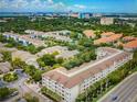 Wide aerial view showing the location of the condo, surrounded by trees and other buildings at 1216 S Missouri Ave # 321, Clearwater, FL 33756