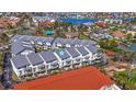 Desirable condo community featuring well-maintained buildings, lush landscaping, and waterfront access at 125 Shoals Cir, North Redington Beach, FL 33708