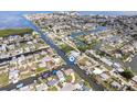 Aerial view of the waterfront community highlighting the canal-front homes and water access at 13437 Lisa Dr, Hudson, FL 34667