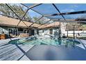 Beautiful screened-in pool area, ideal for outdoor entertaining and relaxation at 1425 Monte Lake Dr, Valrico, FL 33596