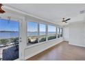 Sun room with wood floor, lots of light, windows, and a view of the waterfront at 19029 Us Highway 19 N # 17A, Clearwater, FL 33764