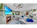 Bright and inviting living room featuring a cozy fireplace and a plush sofa with tasteful decor at 2773 Via Cipriani # 1330B, Clearwater, FL 33764
