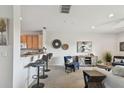 Cozy living area featuring a breakfast bar, comfortable seating, and stylish decor for a relaxed and inviting atmosphere at 31 Estuary Trl, Clearwater, FL 33759