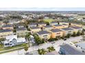 Aerial view showcases colorful homes, neat streets, and a Gathering-friendly neighborhood at 423 Shaddock St, Tarpon Springs, FL 34689